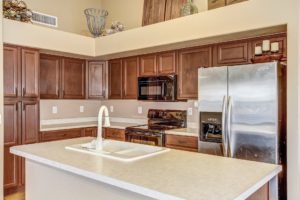 Spacious open kitchen with island and plenty of cabinets and countertops