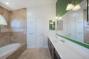 Updated master bath with tile and double sinks